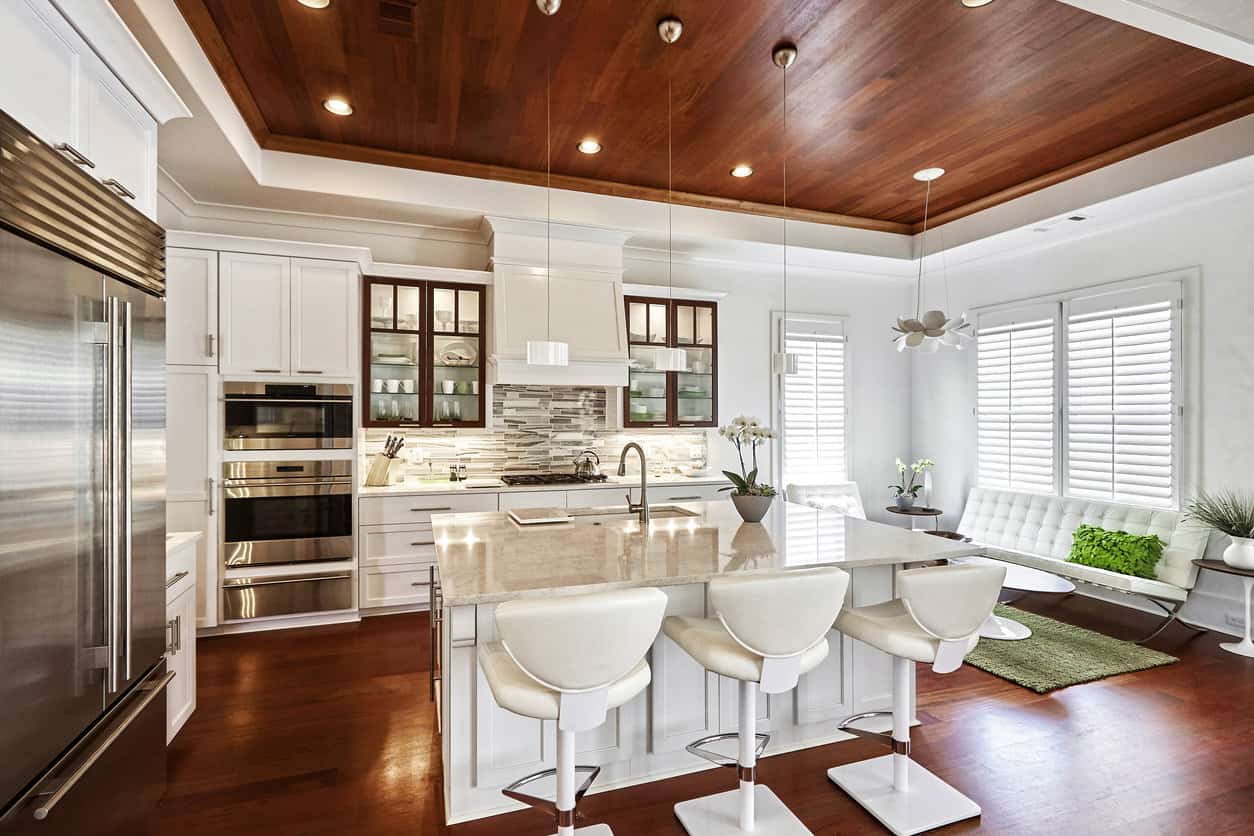 all-white-kitchen-with-red-wood-floor-and-ceiling